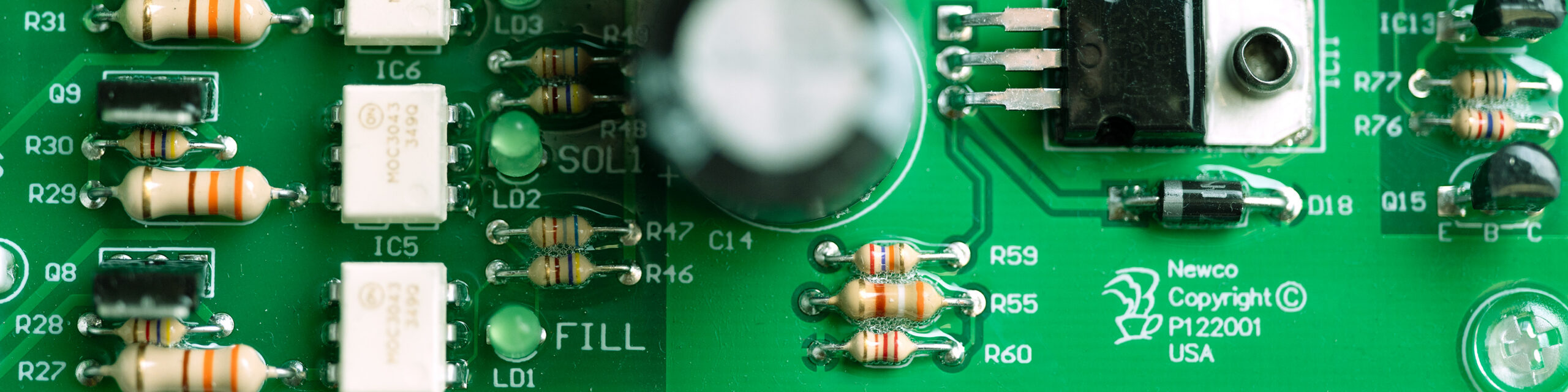 Newco board A green circuit board with the Newco Brand, very close up