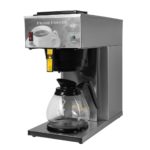 Angle view of stainless steel cabinet, one burner, pour-over AK-1 brewer shown with a glass carafe