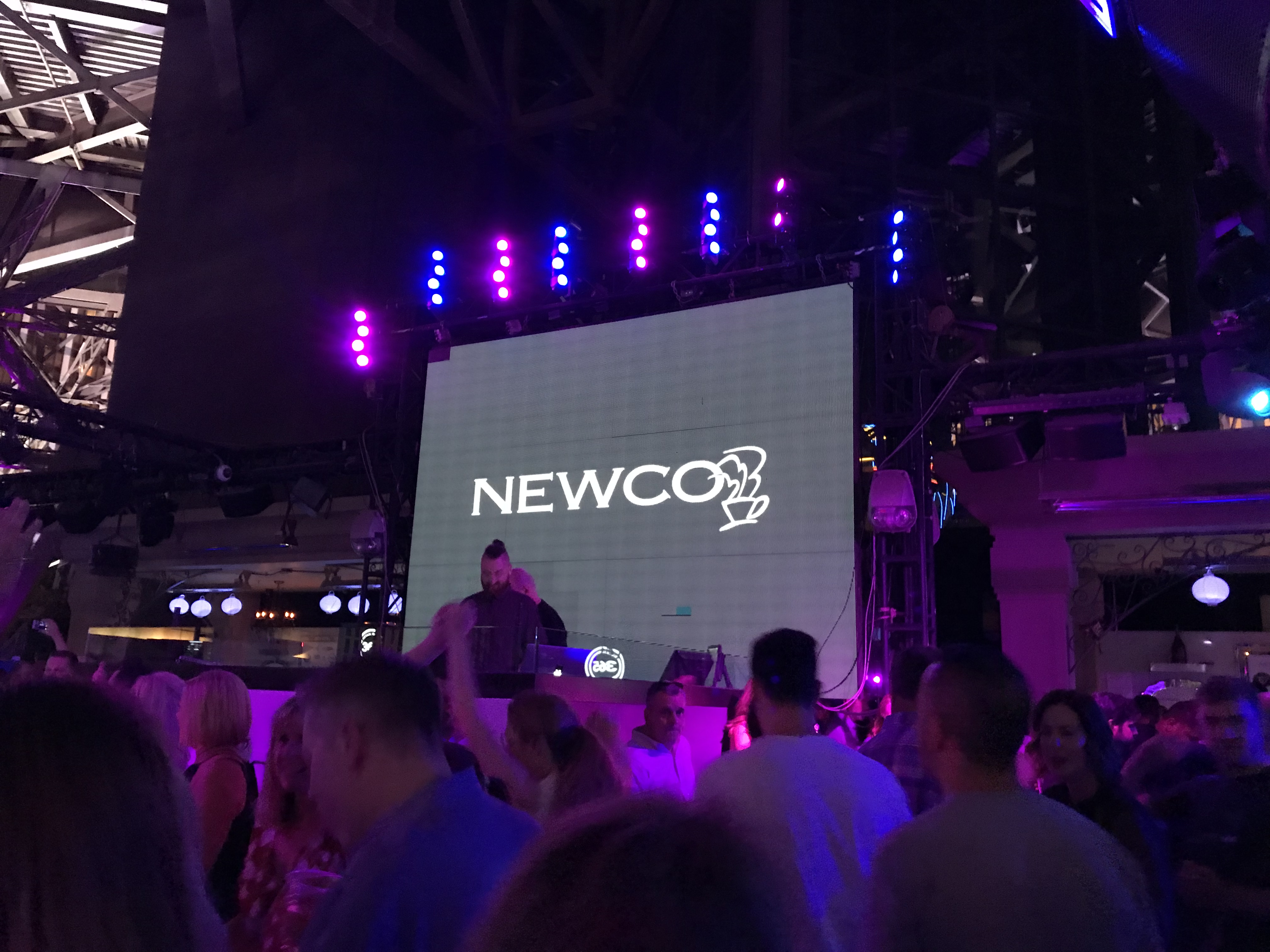 The NAMA Show Party picturing the dj and Newco logo on the screen.